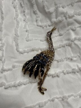 Gold Tone Crane Brooch with Blue and Clear Stones